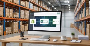 Amazon storage warehouse with floor to ceiling inventory boxes with table with a desktop monitor with the Inventory Optimizer dashboard