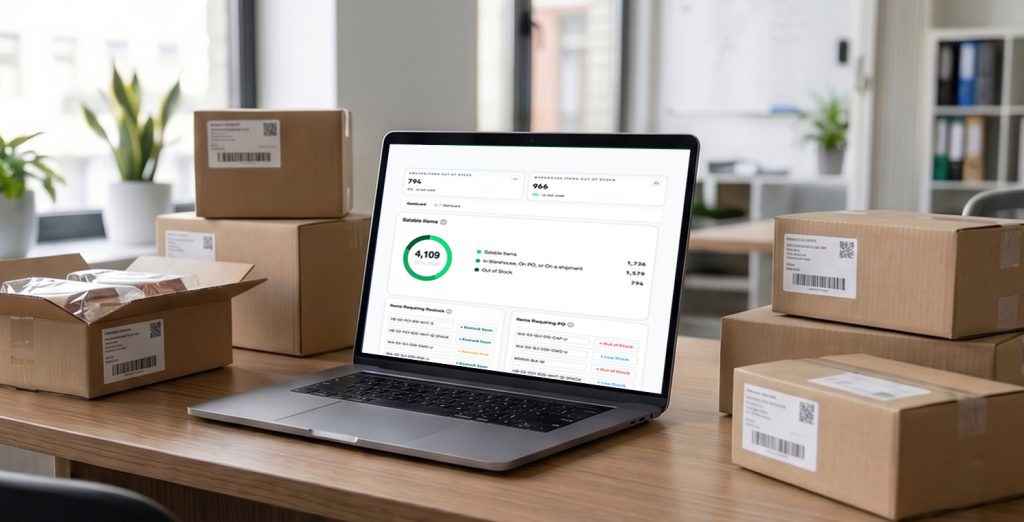 Laptop computer in an office with the screen displaying the Inventory Optimizer dashboard. Boxes of stock on a desk and shelf in the background.